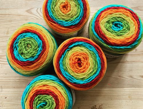 five giant balls of yarn in rainbow colours ready for Rosie's lockdown blanket