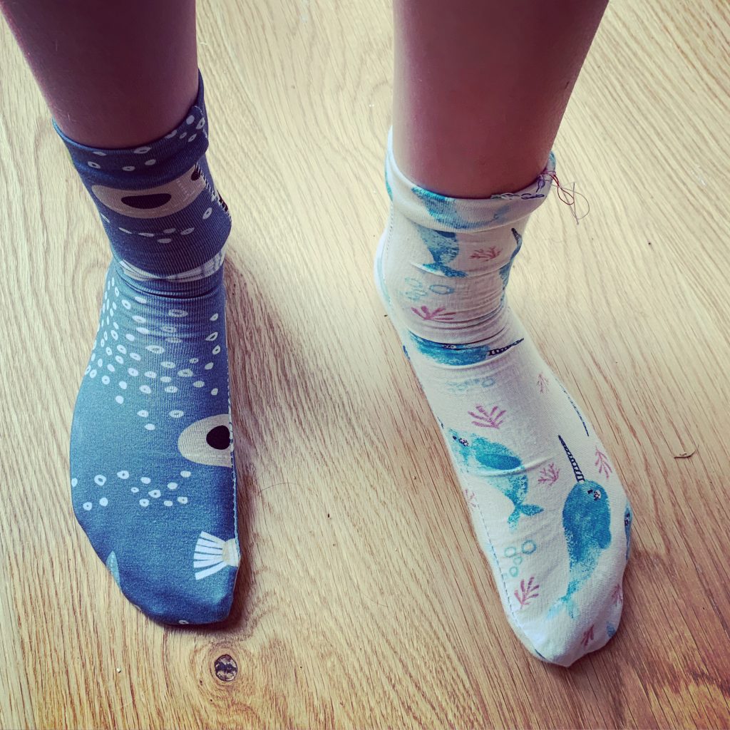 a pair of odd socks made for wellbeing Wednesday