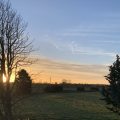 A view over fields at sunrise - inspiration for Rosie's Sky Blanket 2021